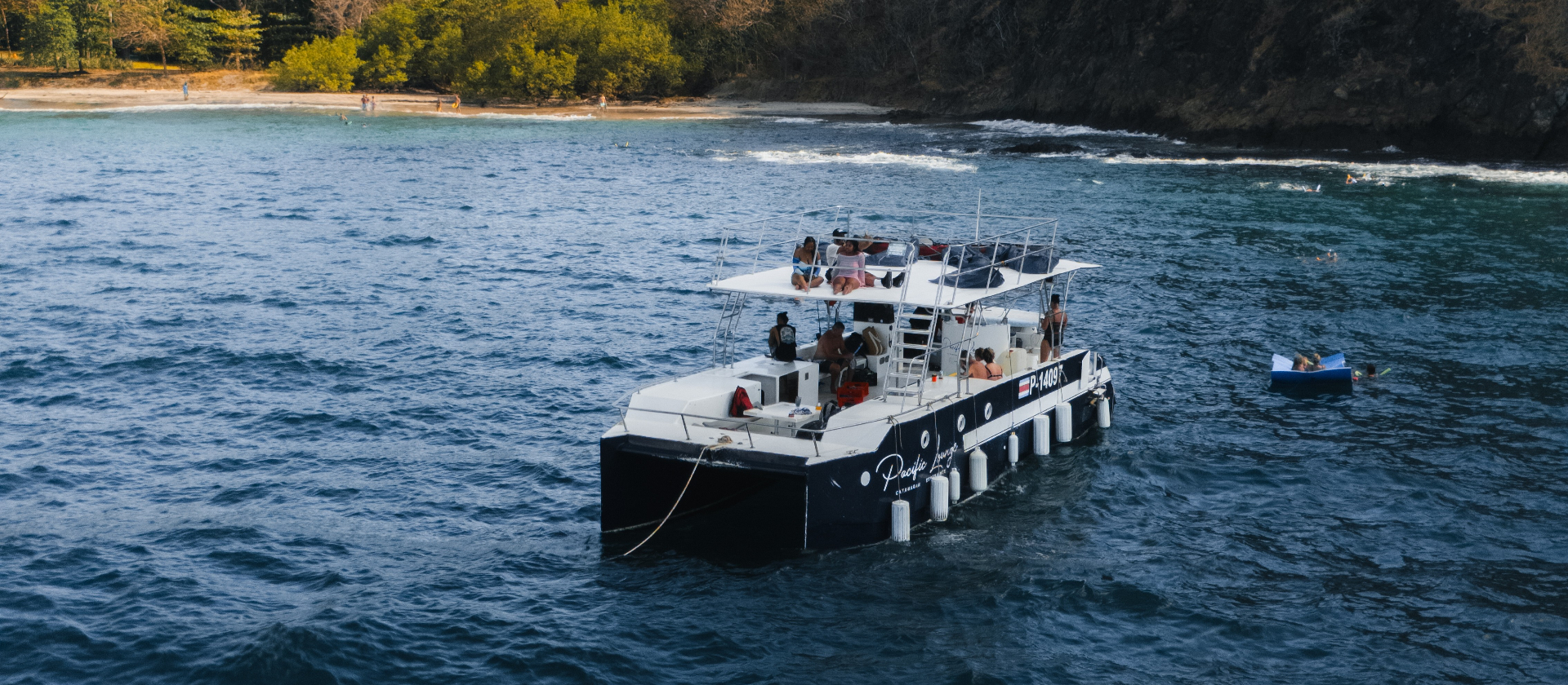 Pacific Lounge catamaran anchored in a Guanacaste bay off Tamarindo