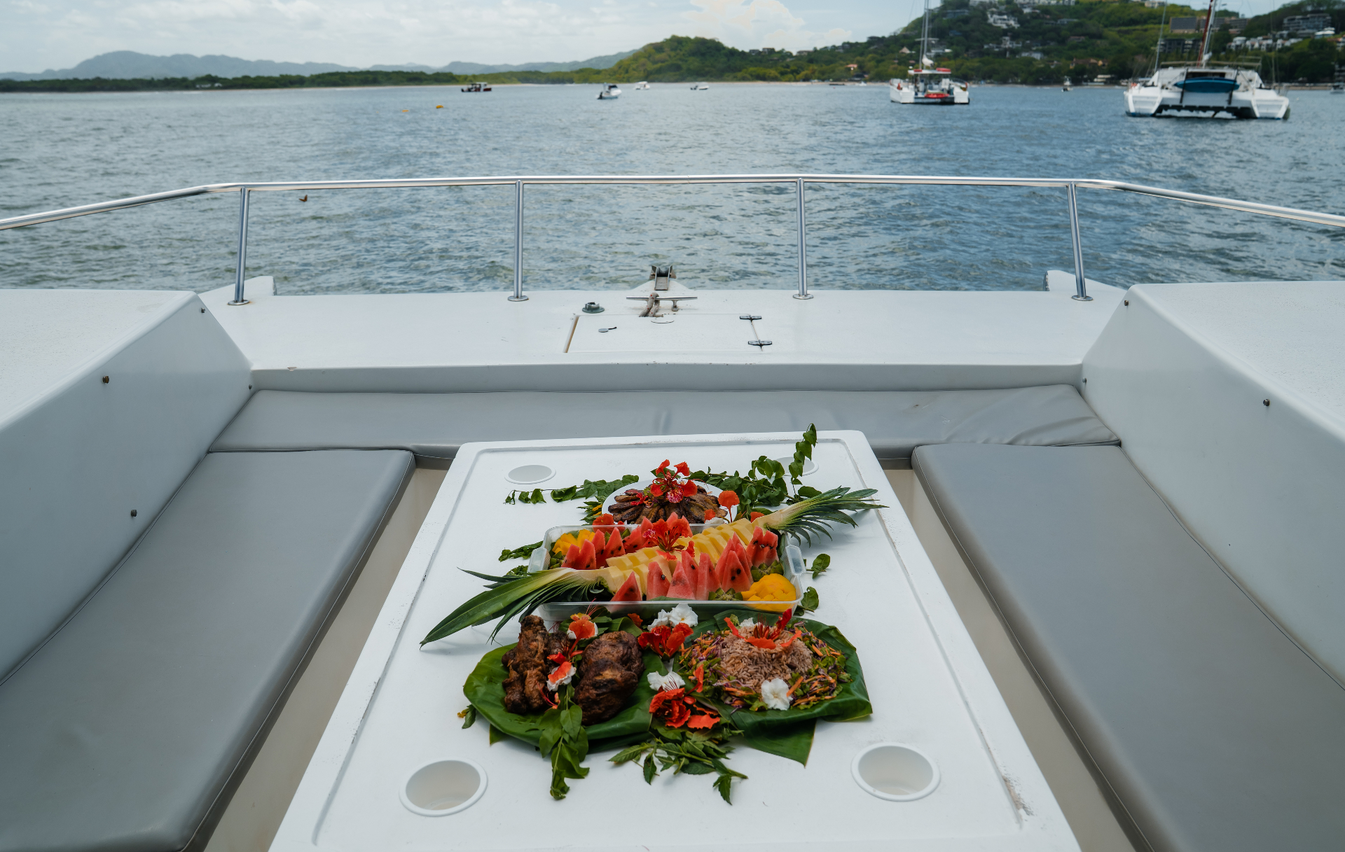 Fresh fruit and Costa Rican lunch spread served on the catamaran deck