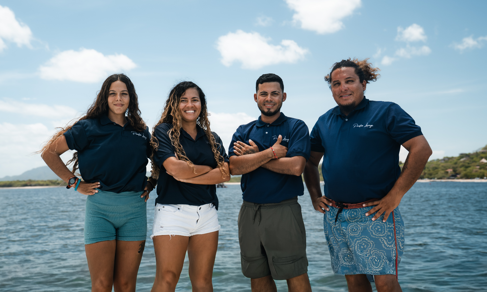 The Pacific Lounge crew standing together on the water in Tamarindo